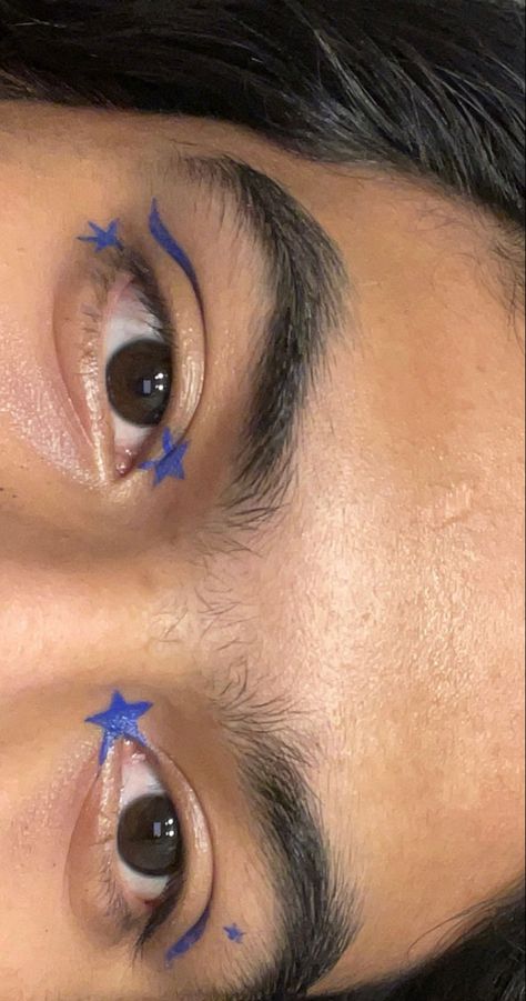 Blue Liner Looks, Blue Star Eye Makeup, Eyeliner Stars Makeup, Graphic Eyeliner Star, Face Eyeliner Art, Blue Graphic Liner Makeup, Eyeliner Art Makeup, Star Eyeliner Looks, Eye Star Makeup