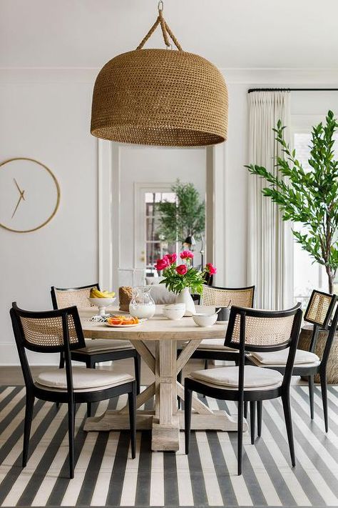 Tan and Black Cane Chairs on Gray Striped Rug - Transitional - Dining Room Black Cane Chairs Dining Rooms, Black Cane Chairs, Round Kitchen Rug, Striped Dining Chairs, Basket Chandelier, Cane Chairs, Cane Dining Chairs, Nook Table, Transitional Dining Room