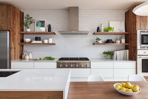 Modern home with Kitchen, Refrigerator, Wall Oven, Range, Range Hood, Engineered Quartz Counter, White Cabinet, Wood Cabinet, Laminate Cabinet, Ceramic Tile Backsplashe, Pendant Lighting, Recessed Lighting, and Undermount Sink. The Heath Ceramics wall tile backsplash was extended to full height and behind floating shelves to add texture and character to the minimal kitchen. Photo  of Los Palmos Kitchen Tile Texture, Kitchen Wall Tiles Backsplash, Trendy Kitchen Tile, Kitchen Floating Shelves, Tiles Backsplash, Laminate Cabinets, Minimal Kitchen, Kitchen Wall Tiles, Open Shelves