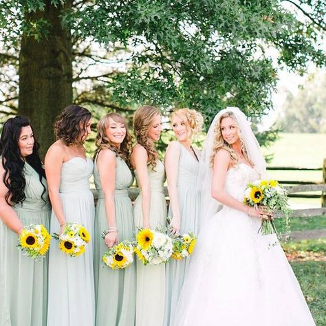 Gorgeous ladies in (shades of) mint green! Their sunflower bouquets are the perfect touch! Photo by @_fashionated_. #wedding #bridesmaids #mint Sage Green And Sunflower Wedding, Shades Of Mint Green, Wedding Redo, 2026 Wedding, Olive Green Bridesmaid Dresses, Sunflower Wedding Decorations, Sunflower Wedding Bouquet, Sunflower Themed Wedding, Sage Green Bridesmaid Dress