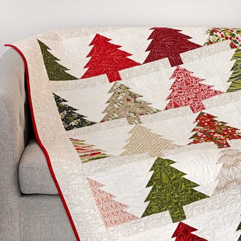 National Sew a Jelly Roll Day: Get Rolling on Your Next Favorite Quilt - The Jolly Jabber Quilting Blog Christmas Jellyroll Quilts Easy, Quilts With Jelly Rolls, Jelly Roll Christmas Tree Quilt Patterns, Christmas Quilts Ideas Free Pattern Jelly Rolls, Christmas Jelly Roll Quilt Patterns Free, Jelly Roll Quilt Patterns Free Ideas, Christmas Jelly Roll Quilt Patterns, Jelly Roll Quilt Blocks, Jelly Roll Christmas Quilt Patterns