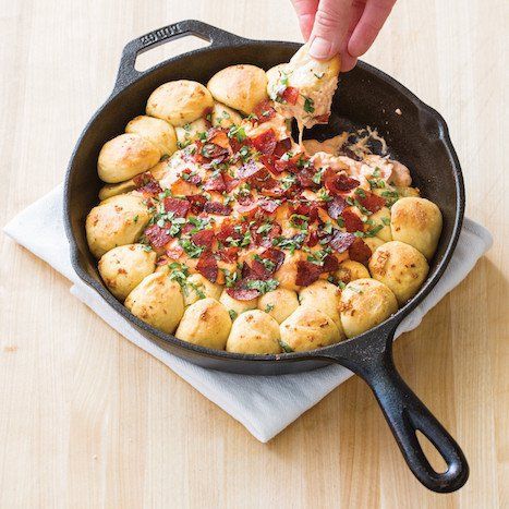 Need an epic Super Bowl snack? Whip up a batch of gooey, decadent Baked Pepperoni Pizza Dip from Cook It in Cast Iron. The cookbook is filled with great tips and recipes from the experts at America’s Test Kitchen to use the iconic cookware, including this crowd-pleasing treat served straight from the skillet for easy [...] Baked Pepperoni, Cheesy Dip Recipes, Pepperoni Dip, Pepperoni Pizza Dip, Pizza Pepperoni, Garlic Knots Recipe, Pizza Dip, Iron Skillet Recipes, Garlic Knots