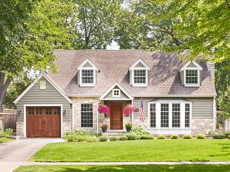 Updated Cape Cod-Style Home With Wood Doors Light Gray Cape Cod House Exterior, Cape Cod Siding Ideas, 1950s Cape Cod House, Home With Dormers, Cape Cod Style Homes, Exterior Vinyl Siding Colors, Cape Cod Exterior, Cape Cod House Exterior, Curb Appeal Ideas