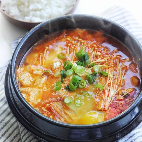 Let us introduce to you one of our favorite Korean dish: soondubu jjigae. For those of you who’ve never heard of it, it is a spicy soup/stew with really soft, silky smooth tofu. It’s often served boiling hot in a clay pot and is eaten with a nice bowl of hot rice. YUM, our mouths are watering...Read More Soondubu Jjigae, Soft Tofu Stew, Jjigae Recipe, Tofu Stew, Koreansk Mat, Soft Tofu, Cibo Asiatico, Spicy Soup, Spicy Korean