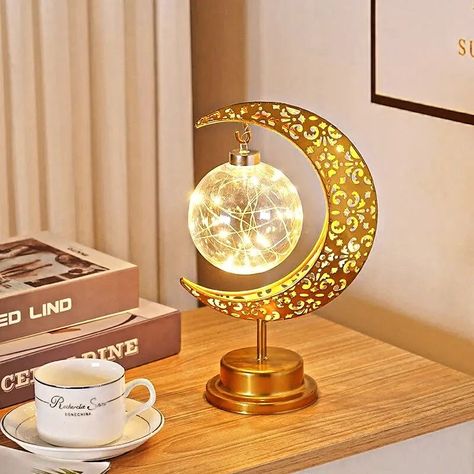 Led Iron moon round ball Shop now https://www.thedecoroyal.com/products/led-iron-moon-round-ball Gold Ramadan Moon Lamp ornament, the perfect addition to your home.while building excitement for Eid. *Makes a beautiful addition to your house table, centerpiece, desk, bookshelf and more. *Made of high quality matal, durable and reusable. *Great gift ideas for family, friends or co-workers. #ramzan #gift #muslims #buynow #shopnowonline #trrnding Led Decoration, Decorative Night Lights, Bedroom Night Light, Creative Lamps, Ramadan Decoration, Star Lamp, Ball Lamps, Stylish Lighting, Lampe Decoration