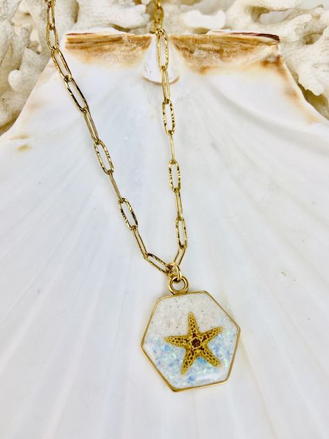 ~~*~~Beautiful Beach Sand necklace ~~*~~ A stunning reminder of relaxing, sunny days and sandy toes! ~~~~~~~~~Anna Maria Island, Fl Beach Sand~~~~~~~~~~~ ~Every Starfish, Opal and Beach Sand necklace is Unique and Beautiful!! -Design- Anna Maria Island beach sand, Starfish, and Azure opal ~The necklace is set in gold hexagon bezel that lets you see the sand through the backside of the pendant. ~cross Gold stainless steel chain 24k gold plated, nickel free, made in the USA Sand Starfish, Sand Necklace, Hexagon Pendant, Fl Beaches, Bradenton Beach, Cross Gold, Necklace Gold Chain, Beach Necklace, Anna Maria Island