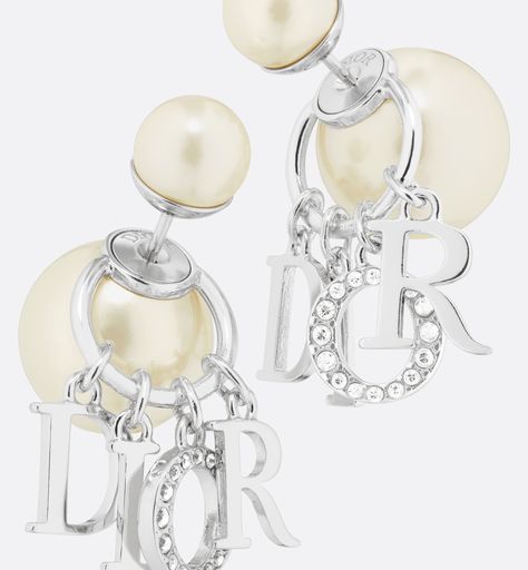 The Dior Tribales earrings offer a new variation on an iconic House style. The white resin pearls are embellished with 'D.I.O.R.' letters in silver-finish metal, with the letter 'O' in a pavé of white crystals. These bold earrings can be paired with other styles from the Dio(r)evolution line.. Expensive Earrings, Lux Gifts, Dior Star, Icon Shoes, Bold Earrings, White Crystals, Star Shoes, Silver Cufflinks, Small Accessories