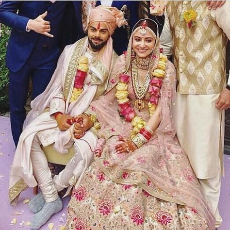 Newly wed @anushkasharma and @virat.kohli beaming with joy ♥  Anushka Sharma is dressed in @sabyasachiofficial Pale pink lehenga with Renaissance embroidery in vintage English colors - embellished with pearls and silver-gold threads ✨ #INSTASHOP Anushka's look by Sabyasachi by sending us a screenshot at +91-9990224411 #carmaonlineshop  #virushka भारतीय दुल्हन संबंधी, Actress Wedding, Anushka Sharma Virat Kohli, Anushka Sharma And Virat, Virat Kohli And Anushka, Virat And Anushka, Couple Wedding Dress, Indian Wedding Couple, Bollywood Couples