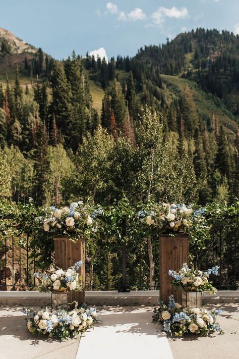 White rose, blue delphinium, blue thistle, scabiosa pod, bunny tail, lysimachia, white anemone, white ranunculus floral - barn wood pedestal ceremony altar Blue And White Wedding Ceremony, Wedding Ceremony Altar, Anemone White, Delphinium Blue, Ceremony Altar, Scabiosa Pods, White Wedding Ceremony, Blue And White Wedding, Blue Thistle