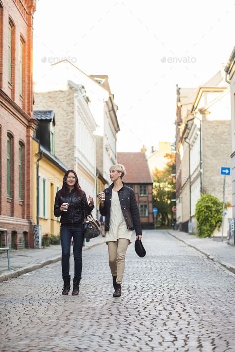 Happy female friends walking with coffee cups on street in city by astrakanimages. Happy female friends walking with coffee cups on street in city #Sponsored #friends, #walking, #Happy, #female Walking With Coffee, Friends Walking Together, Walking Poses, Walking Together, Filmmaking Cinematography, Urban Beauty, Coffee With Friends, Walking Street, Coffee To Go