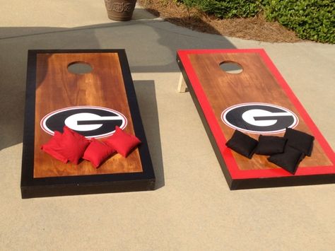 UGA cornhole boards Uga Cornhole Boards, Georgia Bulldogs Cornhole Boards, College Cornhole Boards Designs, Football Cornhole Boards, Bulldog Football, Georgia Bulldawgs, Diy Cornhole Boards, Bean Bag Games, Cornhole Boards Designs