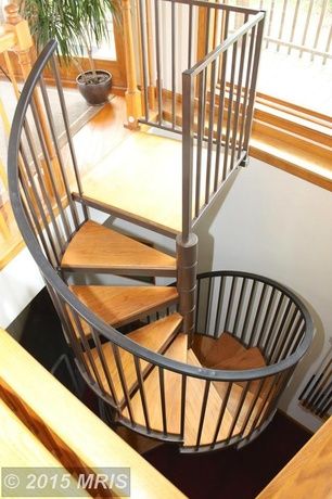 Contemporary Staircase with Spiral staircase, Mylen Stairs Metal Spiral Staircase, Hardwood floors, High ceiling Stairs Design Spiral, Spiral Staircase Drawing, Diy Spiral Staircase, Staircase Plan, Staircase In Living Room, Spiral Staircase Plan, Spiral Staircase Design, Staircase Spiral, Kitchen Under Stairs