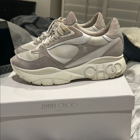 Stylish Jimmy Choo Sneakers. Features A Beige And White Color Scheme. Perfect For Casual Wear.