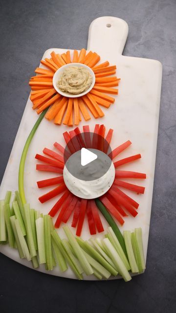 @inox.artisans on Instagram: "Happy Tuesday! We hope your week is going well, but just in case it isn't...we brought you flowers.   Why not break up the week with this fun veggie flower platter? Served on our beautiful artisan-crafted Cortar Marble Charcuterie Board, this veggie and dip snack is a real crowd-pleaser.   Visit our website and check out our recipe section for easy prep appetizers and more!   🌻🌻🌻  #veggieplatter #veggieplatterlove #veggiedips #marble #marblecharcuterieboard" Flower Veggie Board, Charcuterie Flowers, Marble Charcuterie Board, Veggie Dip, Snack Tray, Crowd Pleaser, Happy Tuesday, Artisan Craft, Charcuterie Board