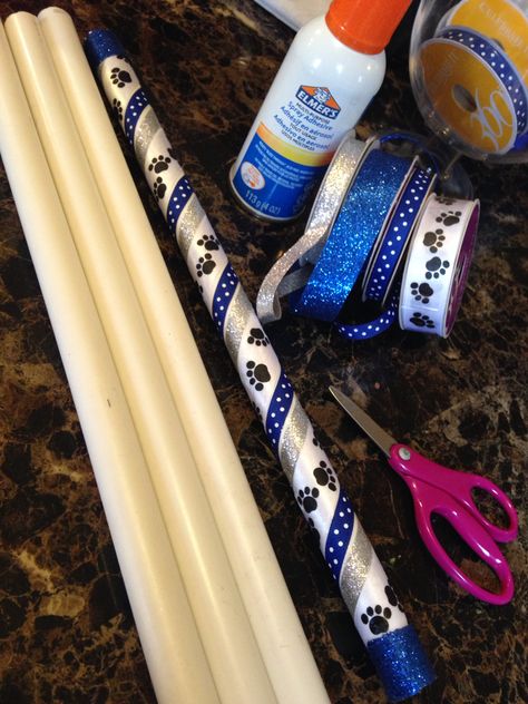 PVC Pipe turned into Spirit Sticks for each girl at the end if the season! Spirit Stick Ideas Diy How To Make, Cheer Spirit Sticks Ideas, Diy Cheer Spirit Stick, Cheerleading Spirit Stick Ideas, Dance Spirit Sticks, Cheerleader Spirit Sticks, Homecoming Spirit Sticks, Diy Cheer Spirit Sticks, How To Make Spirit Sticks Cheer