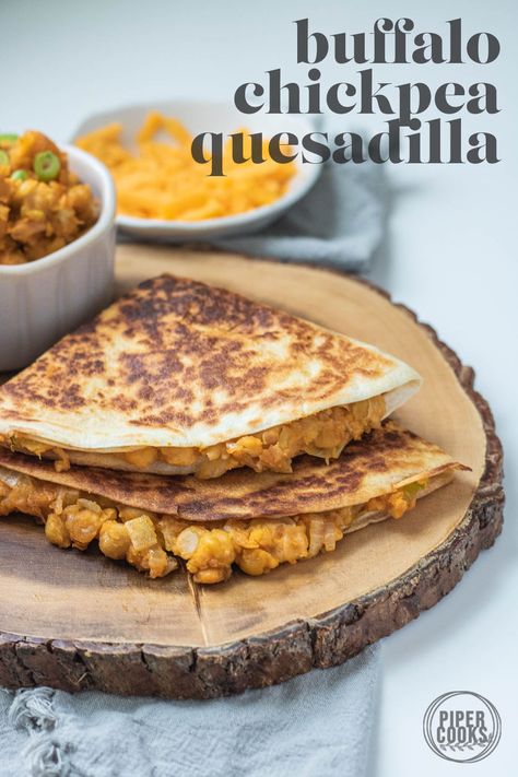 If you're looking for some inspiration for your next Meatless Monday stop here! This cheesy, spicy Buffalo Chickpea Quesadilla is just what you need if you're looking for quick and easy comfort food. Boldly flavored with sharp cheddar cheese and Sriracha hot sauce, this smashed chickpea quesadilla will only take about 20 minutes to put together for a quick weeknight dinner. Chickpea Quesadillas, Buffalo Chickpeas, Quick And Easy Comfort Food, Vegan Cheese Substitute, Smashed Chickpea, Buffalo Chickpea, Curry Ramen, Shredded Cheddar Cheese, 20 Minute Recipes