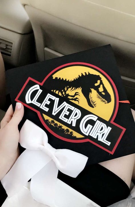 Jurassic Park Graduation Cap Jurassic Park Graduation Cap, Dinosaur Graduation Party, South Park Graduation Cap, Dinosaur Graduation Cap, Jurassic Park Theme, Diy Grad Cap, Funny Graduation Caps, Creative Graduation Caps, Graduation Cap Decoration Diy