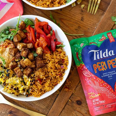 Peri Peri chicken recipe | Tilda Rice USA Chicken With Bell Peppers, Nandos Peri Peri Chicken, Peri Chicken Recipe, Peri Peri Chicken Recipe, Stuffed Bell Peppers Chicken, Peri Chicken, Peri Peri Chicken, Rice Bowls Recipes, Peri Peri