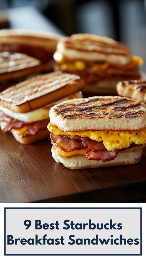 A close-up image of a variety of Starbucks breakfast sandwiches on a wooden board, featuring options like Bacon, Gouda & Egg and Double-Smoked Bacon, showcasing fresh ingredients and golden, toasted bread. Starbucks Double Smoked Bacon Sandwich, Starbucks Breakfast Sandwich, Starbucks Breakfast, Bacon Sandwich, Breakfast Sandwiches, Starbucks Recipes, Smoked Bacon, Move It, Breakfast Treats