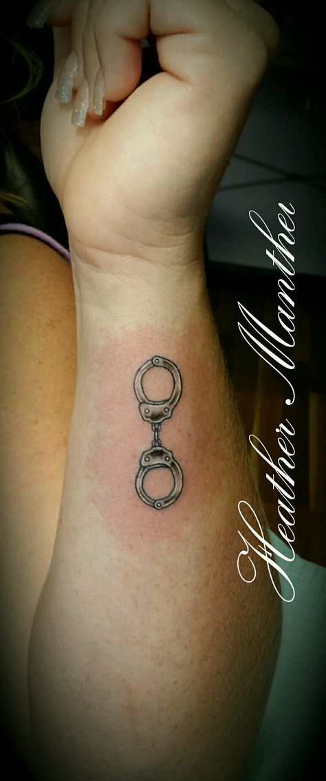 Handcuff tattoo design. Thank u Mande! Handcuff Tattoo Small, Handcuffs Tattoo Design, Female Law Enforcement Tattoos, Police Officer Tattoos Female, Police Tatoos Ideas, Handcuff Tattoo For Women, Cop Wife Tattoo, Small Police Tattoo Ideas, Police Tattoo Ideas Women