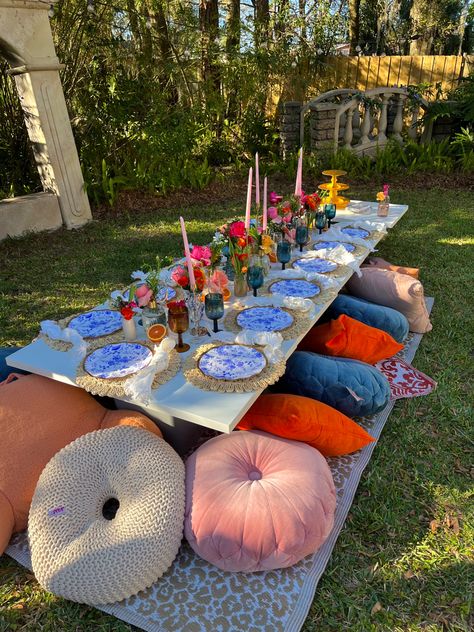 #picnic #picnicfoodideas #springdecor #springoutfit #springsummer2023 #springfunonmdr #flowers #flowerslovers #floral #pink #pinkcore #girlpower #girlystuff #girlygirlaesthetic #partyfood #partythemes #picnicparty #crochet #backyard #trending #candleholder #candles #candlelight #cushions Spring Picnic Table Decor, Floral Picnic Birthday Party, Colorful Picnic Party, Big Picnic Party, Picnic Setup Ideas, Colourful Picnic, Thanksgiving Tablescapes Ideas, Picnic Table Party, Thanksgiving Tablescapes Simple