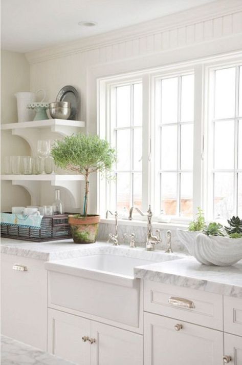 Coastal kitchen with white marble top counters, white cabinets and elegant hardware Cottage Kitchens, Classic Kitchen, Marble Counter, Single Bowl Kitchen Sink, Kitchen Farmhouse, Farmhouse Sink, Cottage Kitchen, Counter Tops, Kitchen Window