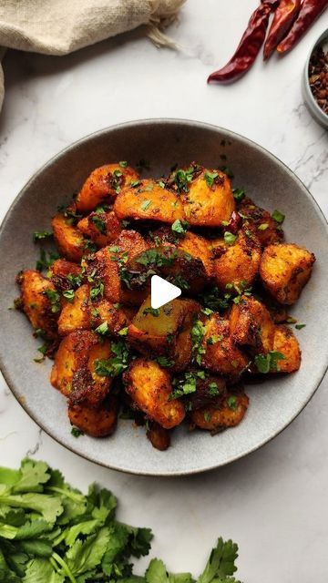 Dan Dumbrell on Instagram: "Spicy Sichuan Roast Potatoes recipe 🥔🔥  Take your taters to the next level with this cracker of a recipe! These Spicy Sichuan-inspired Roast Potatoes are a little spin on Batata Harra - a traditional spicy Lebanese potato dish. This recipe parboils and roasts the potatoes until crispy, which are then tossed through a spicy/numbing Sichuan-inspired tomato based paste. Give this one a go the next time you're looking for something to do with those potatoes 😘  Ingredients 1kg roasting potatoes  2 Tbsp salt 1 Tbsp baking soda 5 Tbsp olive oil (divided into 3 and 2 Tbsp) 6 garlic cloves (minced) 6 dried chillis (cut up) 1 Tbsp sweet chilli flakes (optional) 1.5 tsp Sichuan peppercorn powder 2 Tbsp tomato paste 1 Tbsp soy sauce 1/2 cup chopped coriander leaves  Meth Roasting Potatoes, Batata Harra, Sichuan Peppercorn, Roasted Potato Recipes, Roast Potatoes, Potato Recipe, Chinese Recipes, Coriander Leaves, Sweet Chilli