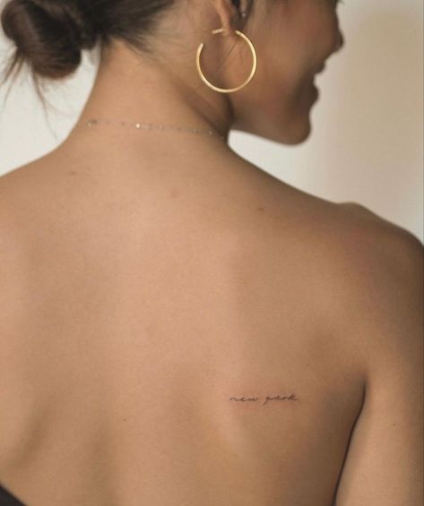 Tattoo Phrases Placement, Small Cursive Back Tattoo, Word On Back Tattoo, Small Subtle Tattoos For Women, Micro Tattoo Placement Ideas, Text Tattoo Women, Tiny Tattoo Font, Tattoo Ideas Female Placement, Kaia Gerber Tattoos