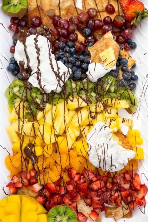 RAINBOW FRUIT NACHOS ARE A FUN AND YUMMY WAY TO INCLUDE AN EASY DESSERT WHILE GETTING IN MORE FRUITS, MAKING THIS A HEALTHIER OPTION! Big Desserts, Fruit Nachos, Awesome Appetizers, Random Recipes, Rainbow Fruit, Cold Desserts, Fruity Desserts, Happy Foods, Tasty Bites