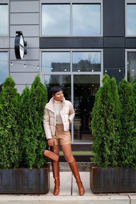 Brown Leather Shorts Outfit Fall, Cream Leather Shorts Outfit, Beige Leather Shorts Outfit, Tan Leather Shorts Outfit, Faux Leather Shorts Outfit Winter, Tan Boot Outfit, Long Black Winter Coat, Winter Shorts Outfits, Leather Shorts Outfit