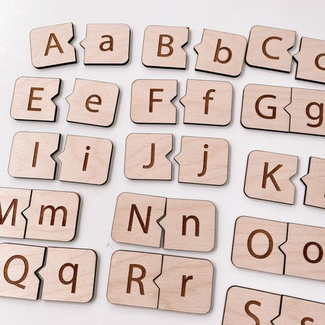 "Alphabet dominos are perfect for little ones learning to write and spell. Practice matching the uppercase and lowercase letters of the alphabet. Comes as a set of 52 tiles, 26 uppercase and 26 lowercase, in a compact wooden box for easy storage. Each individual tile measures 1.5\" x 1.5\" cut on 1/8\" birch." Wood Crafts For Kids, Didactic Toys, Alphabet Matching Game, Engraver Ideas, Montessori Alphabet, Wooden Alphabet Puzzle, Wood Inspiration, Lacing Cards, Wood Projects For Kids