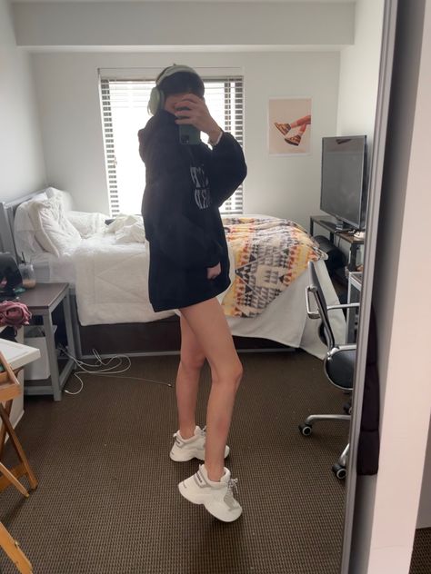 comfy casual oversized black hoodie claw clip hair and mini shorts with platform white naked wolfe sneakers spring summer outfit Oversized Hoodie Outfit Shorts, Comfy Hoodie Outfit, Naked Wolfe Sneakers, Oversized Hoodie Outfit, Short Girl Outfits, Claw Clip Hair, Naked Wolfe, Tiny Shorts, Spring Sneakers