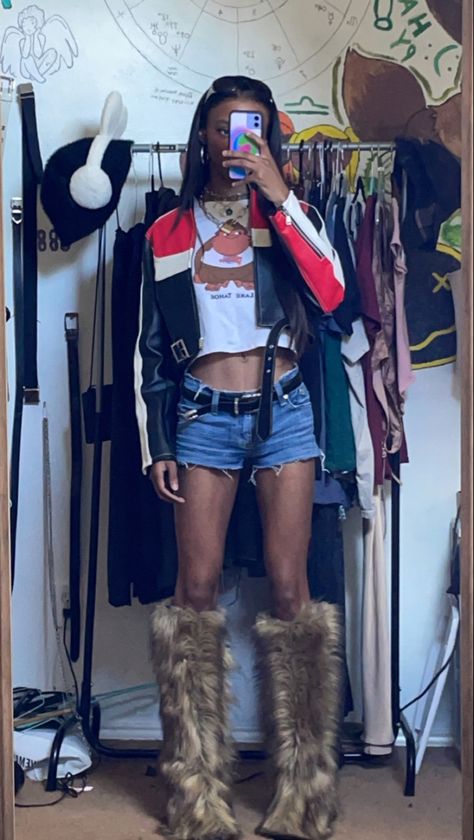 Edgy and stylish fashion inspo! Rocking a cropped leather moto jacket with red and white stripes, a graphic baby tee, daisy dukes, a black western-style belt, oversized sunglasses, and fur boots. Get inspired and create your own unique look! #FashionInspo #EdgyStyle #CroppedJacket #StripedFashion #GraphicTee #DaisyDukes #WesternBelt #OversizedSunglasses #FurBoots #Fashionista Red And White Leather Jacket, Cold Clothes, Black Leather Jacket Outfit, Graphic Baby Tee, Leather Jacket Outfit, White Leather Jacket, Baby Graphic Tees, Cold Outfits, Leather Jacket Outfits