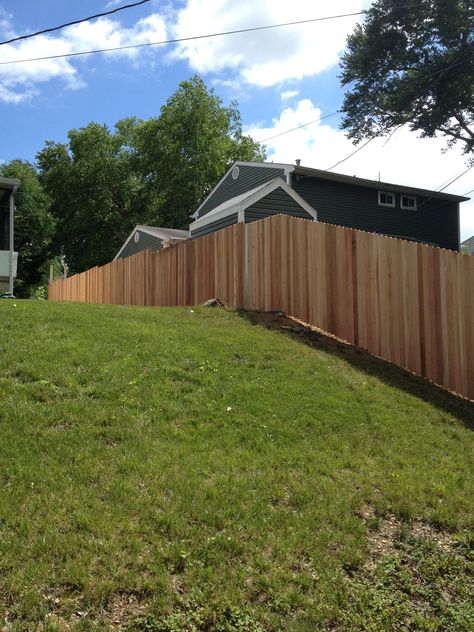 Cedar fence. Sloped back yard. Panels built in place on a slope. Privacy Fence On A Hill, Fence On Hill, Wood Fence On Slope, Fence On Steep Slope, Privacy Fence Sloped Yard, Fence For Hilly Yard, Sloped Yard, Glass Fence, Cheap Fence