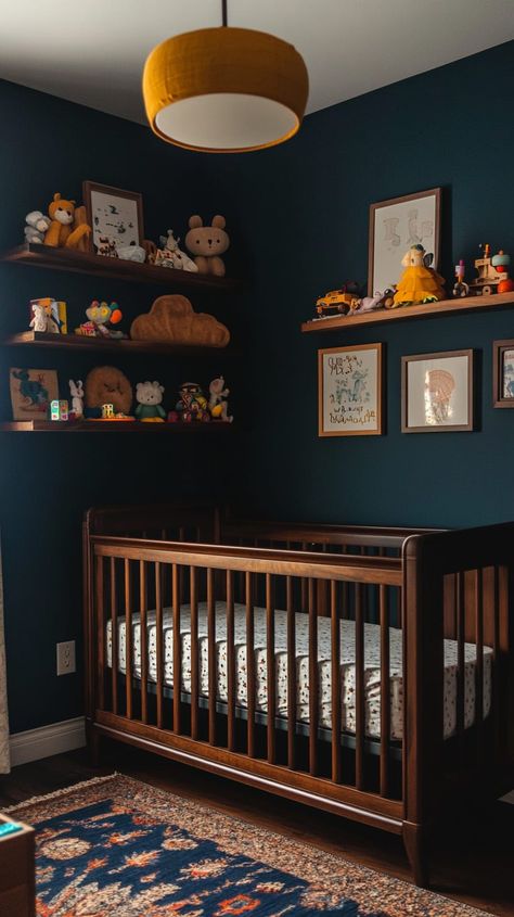 Cozy gender-neutral nursery with dark blue walls, vintage crib, wooden shelves, soft lighting, and whimsical decor. Deep Blue Nursery, Dark Teal Nursery, Navy Baby Room, Colorful Boy Nursery, Dark Blue Nursery, Nautical Theme Nursery, Navy Nursery Boy, Gender Neutral Nursery Design, Navy Blue Nursery