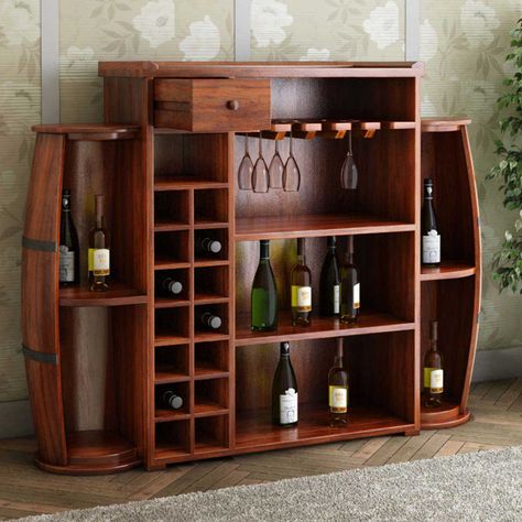 Featuring modern details, the Harrod Handcrafted Rustic Solid Wood Barrel Design Home Bar Cabinet with 14 Bottles Wine Rack & 9 Shelves adds a stylish functionality to your dining or bar area. The rustic medium brown finish over solid rosewood sums it up into a rustic romance to accent your interiors while its 14 bottle holder rack provides you with space to showcase your favorite wines. It also features a small drawer on the top to store bar accessories while the wine glass rack is perfect Bar Cabinet Designs, Corner Bar Furniture, Bar Furniture Ideas, Wine Buffet, Wooden Bar Cabinet, Bar Furniture For Sale, Home Wine Bar, Small Bars For Home, Repurpose Furniture