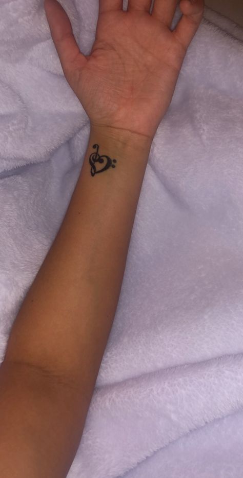 Music Notes On Wrist Tattoo, Music Note Tattoo On Hand, Music Therapy Tattoo Designs, Heart And Music Tattoo, Tattoo Ideas Female Music, Musical Tattoos For Women, Music Note Tattoos For Women, Heart Music Tattoo, Music Note Tattoo Behind Ear