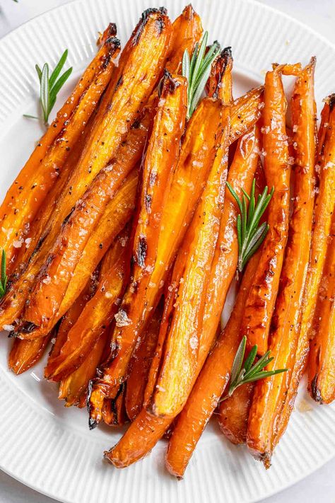 Maple glazed carrots are a perfect side dish for any meal and especially holiday dinners. They are simply brushed with simple ingredients of melted butter, maple syrup, and brown sugar then roasted until perfectly caramelized and fork-tender! Maple Syrup Carrots, Thanksgiving Veggies, To Simply Inspire, Maple Glazed Carrots, Glazed Carrots Recipe, Butter Carrots, Holiday Dinners, Glazed Carrots, Maple Glaze