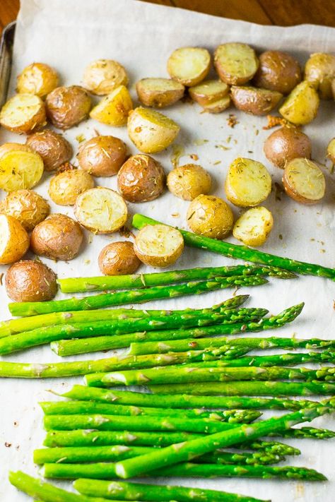 This roasted baby potatoes and asparagus dish is flavored with rosemary and garlic. The potato is tender & flavorful while the asparagus is crisp-tender. Potatoes And Asparagus Recipes, Potato And Asparagus Baked, Potatoes And Asparagus Baked, Baking Asparagus, Roasted Asparagus And Potatoes, Potato And Asparagus Recipe, Asparagus And Potatoes, Asparagus Recipes Baked Oven Roasted, Potatoes Asparagus