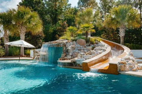 Sliding Rock Lagoon Custom Pool in Wilmington, NC Pool With Grotto And Slide, Modern Pool With Waterfall, Rock Pool Slide, Rock Slide Pool, Pool Slides Inground, Backyard Pool With Slide, Lagoon Pool Backyard, Fancy Pools, Pool With Stone