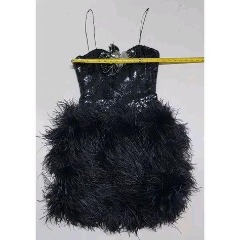 This Vintage Lillie Rubin Mini Dress Is A Stunning Piece That Will Make You Stand Out From The Crowd. The Dress Features Ostrich Feathers As Accents, Adding A Touch Of Elegance To The Overall Look. It Is Made In The United States And Is Available In Size 8, With A Sleeveless Design And A Short Dress Length. The Black Color Of The Dress Is Perfect For Any Occasion, And The Vintage Style Adds A Touch Of Nostalgia. This Dress Is Suitable For Women Of Any Department, And The Regular Size Type Ensures A Comfortable Fit. The Dress Is Perfect For Those Who Love Fashion And Want To Make A Statement. Ostrich Feathers, Love Fashion, Short Dress, The Vintage, The Black, Dress Length, Vintage Dresses, Feathers, Black Color