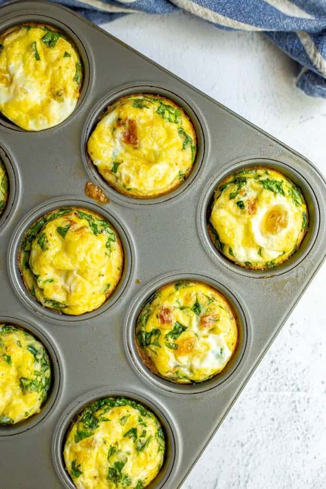 Breakfast egg muffins are loaded with bacon, spinach and cheese and baked in the oven for a delicious warm breakfast that’s perfect for brunch or for meal prep. They freeze and reheat great and you can customize the add-ins! #eggmuffins #breakfast #mealprep #breakfastideas #eggs Basic Deviled Eggs Recipe, Breakfast Egg Muffins, Spinach Muffins, Egg Muffins Recipe, Greek Yogurt Flavors, Healthy Blueberry Muffins, Egg Muffins Breakfast, Food On The Table, Warm Breakfast