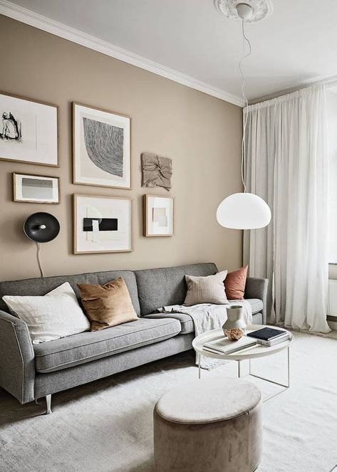 Small studio with beige walls - via Coco Lapine Design blog  // Shop now at www.wallandroom.com Follow us on instagram: @wallandroom One Colored Wall Living Room, Wall Paint For Small Living Room, Living Room One Wall Different Color, Rooms With Beige Walls, Beige Color For Living Room, Sandy Wall Color, Living Room Decor Beige Walls, Small Paintings On Wall, Modern Wall Colors Living Room