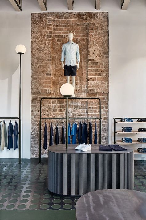 carbon studio + KUUB turn 12th century building into retail space in utrecht Clothing Store Decor, Marmoleum Floors, Industrial Fashion, Design Studio Workspace, Sandstone Wall, Tokyo Design, Retail Concepts, Roof Construction, Retail Interior