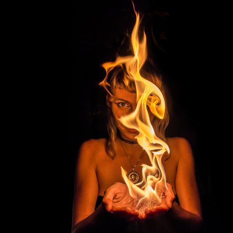 Woman Fire Photography, Woman On Fire Art, Fire Fashion Photography, Fire Photography Portrait, Holding Fire Pose, Holding Fire Pose Reference, Flames Photoshoot, Fire Photography Ideas, Fire Sign Photoshoot Ideas