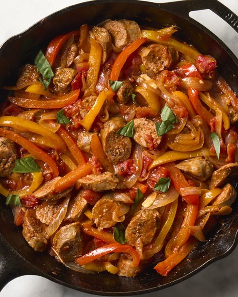 overhead shot of sausage and peppers in cast iron, topped with basil Sausage Meals, Italian Sausage And Peppers, Pan Sausage, Italian Pork, Sausage Dinner, Salmon Potato, Red Sauce Pasta, Cajun Dishes, Lunch Appetizers