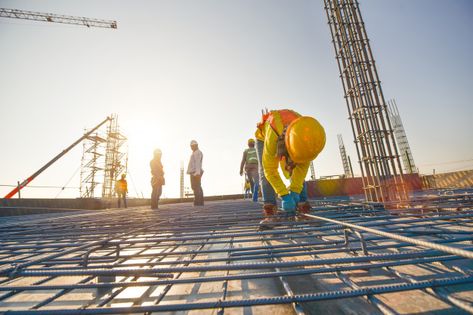 Construction workers fabricating steel reinforcement bar at the construction site Premium Photo Ing Civil, Green Construction, Building Icon, Civil Construction, Sustainable Technology, Shop Buildings, Construction Workers, Roofing Companies, Roofing Services