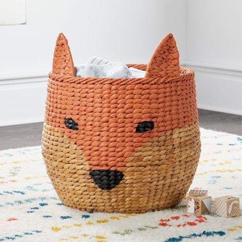 Shop Fox Floor Bin. We don't like to brag, but this Fox Floor Bin just might be our all-time cleverest storage piece. It's woven from real water hyacinth, giving it a lovely natural charm. And with an iron frame, it has the durability you need for the nursery, kids room or playroom. Outdoorsy Decor, Kids Storage Bins, Kids Toy Boxes, Fox Nursery, Kids Baskets, Basket And Crate, Toy Storage Baskets, Toy Bins, Kid Toy Storage