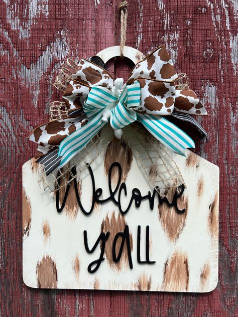 Highlander Cow Door Hanger, Boutique Crafts That Sell, Cow Head Door Hanger Wooden, Door Sign Ideas Entrance, Yellowstone Door Hanger, Cow Cricut Projects, Racing Door Hanger, Western Door Sign, Diy Cow Print Decor