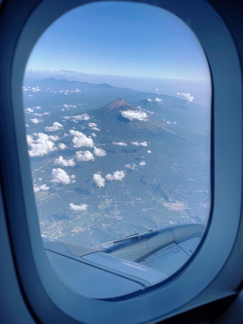 Window view from my airplane seat of a mountain in Bali, Indonesia. Airplane Window, Bali, Indonesia